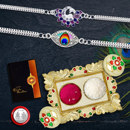 Stylish Silver Rakhi Gift Combo – 2 Designer Rakhis (Peacock & Swan), Chocolates, Coin, Tikka Set & Greeting Card